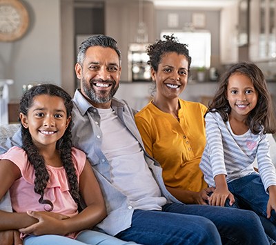 Happy multiethnic family sitting together